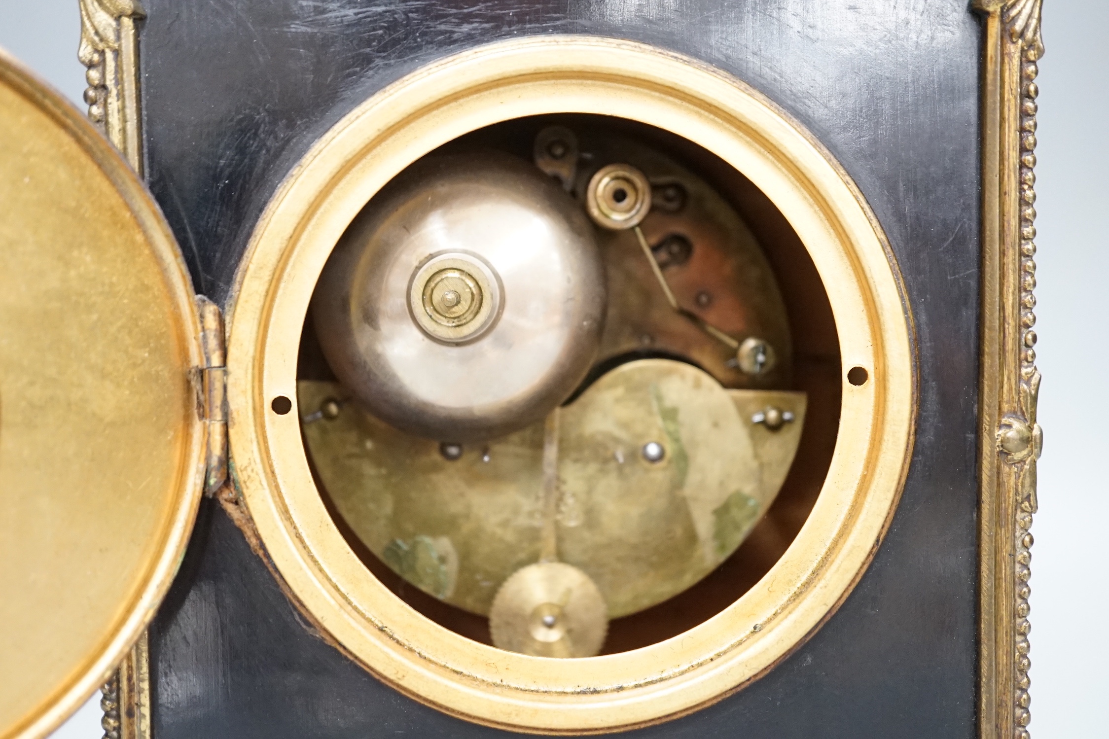 A 19th century brass and ebonised mantel clock